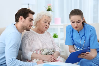 nurse talking with elderly patient