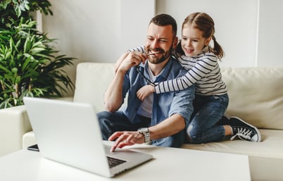 happy customer with daughter on computer